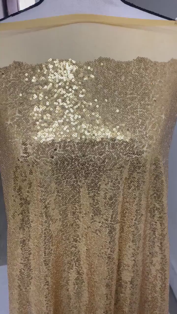 Gold color sequins mesh fabric. common use in craft, jacket, costume, dull, table runner, color gold.