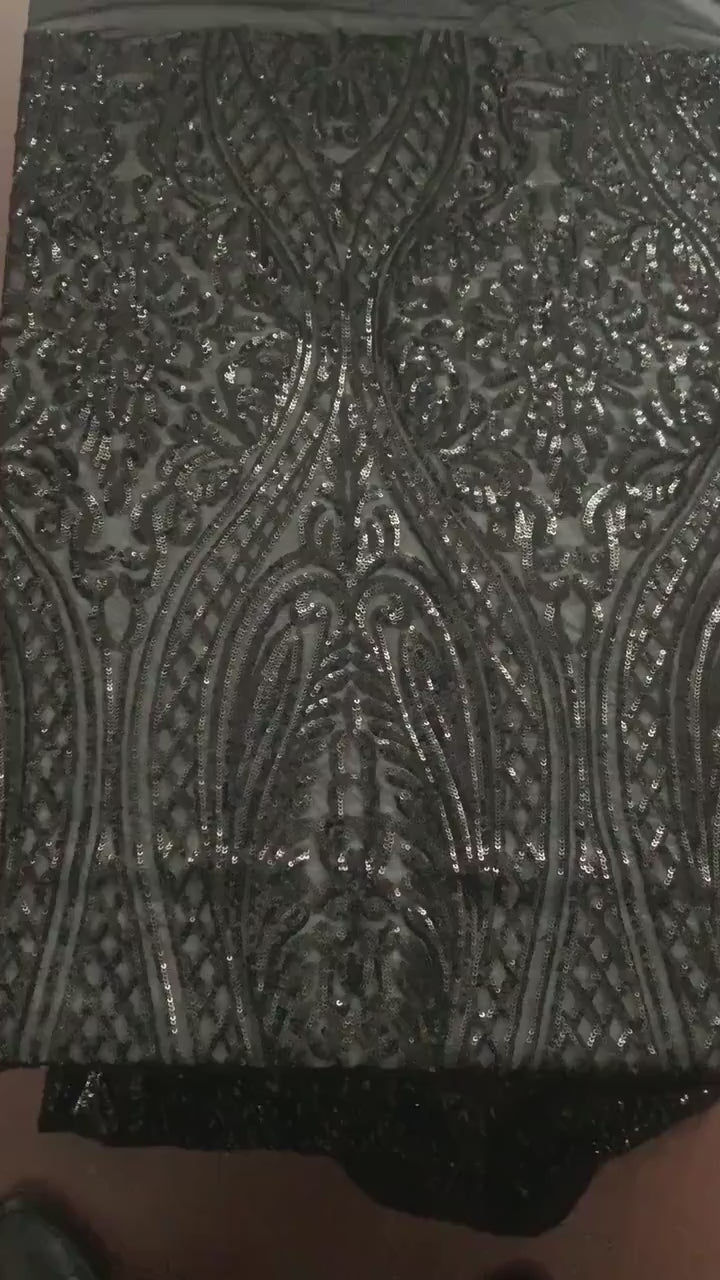 Black All over Sequins fabric color black width 55 inches, fabric has 3 inch salvage (plain mesh) on each side. free sample.
