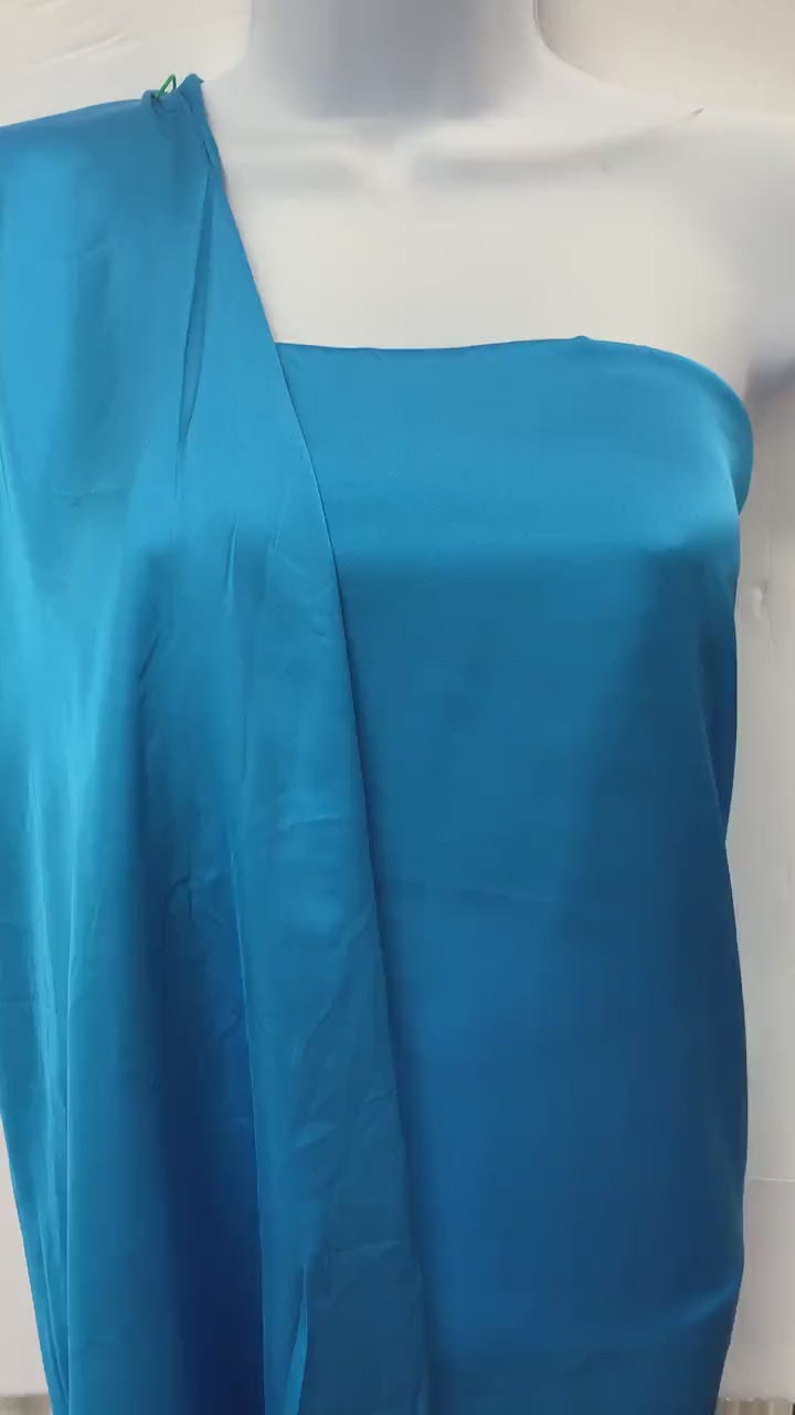 Silky dull satin fabric sell by yard 58/60" 100% polyester. Turquoise colorsmooth texture. Perfect for stylish tops and blouses.