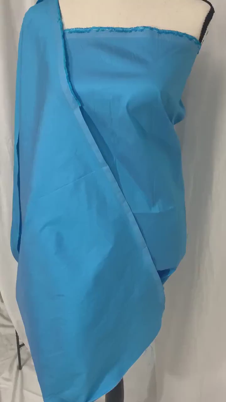 A 2 yards cut Taffeta fabric color turquoise. width 58" polyester. sell by 2 yards increment continuous.