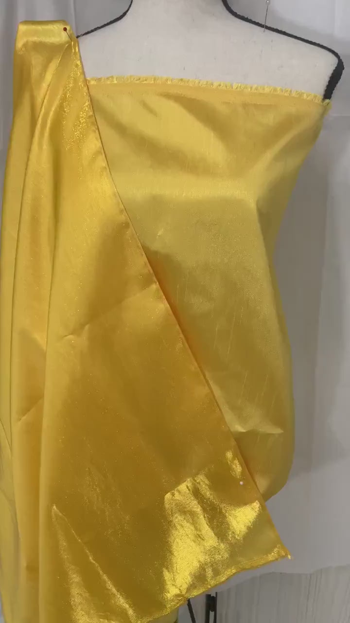 Yellow shimmer shantung fabric, width 58". Is a double sided fabric with slub, shimmery and dull sides dry clean fabric. Free sample.