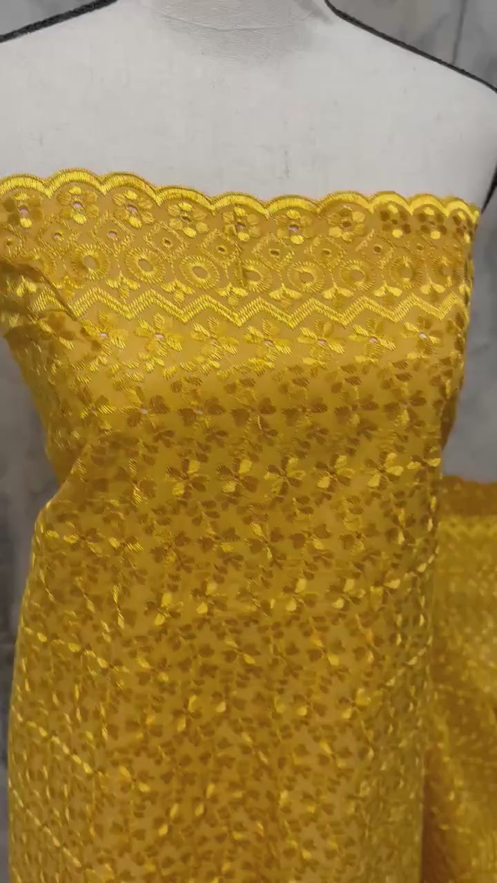 Eyelet fabric made of poly-cotton with all-over embroidery and double scalloped edges for a delicate finish. color Gold design # 2